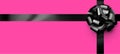 Beautiful foil black bow with ribbon on pink background