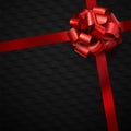 Beautiful foil red bow with ribbon on black background
