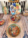 Beautiful food plates with various colorful decorative patterns on the shop window