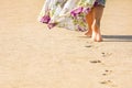 A Beautiful foot footprints in the sand killing on nature background