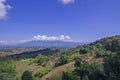 Beautiful forests and mountains with blue sky background in sunlight Royalty Free Stock Photo