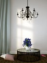 Beautiful forged chandelier over the coffee table Royalty Free Stock Photo