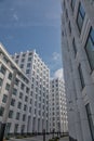 Beautiful forms of modern buildings. Windows and walls of houses.