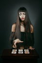 Beautiful fortune teller with tarot cards