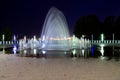 Beautiful fountain at night against blue sky. Evening view of Dnipro city. Creative water design, arched fountain, elegant Royalty Free Stock Photo