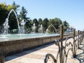 Beautiful fountain in the sun. Fountain in the city. Jets of water Royalty Free Stock Photo