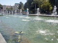 Beautiful fountain in the sun. Fountain in the city. Jets of water Royalty Free Stock Photo