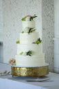 Beautiful four tiered wedding cake with roses for wedding reception