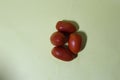 Beautiful four tomatoes on light green background