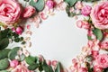 Beautiful frame made of pink roses and eucalyptus on white background Royalty Free Stock Photo
