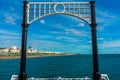 Beautiful frame view of Brighton Pier with Brighton beach sea, sand in the background. Royalty Free Stock Photo