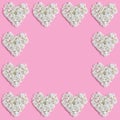 beautiful frame of white hearts on a pink background. fresh hydrangea flowers. Royalty Free Stock Photo