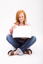 Beautiful freckled teen with computer Royalty Free Stock Photo