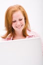 Beautiful freckled teen with computer Royalty Free Stock Photo