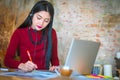 Beautiful freelancer female talking in a video conference on lin Royalty Free Stock Photo