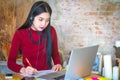 Beautiful freelancer female talking in a video conference on lin Royalty Free Stock Photo