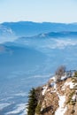 Beautiful french alps winter panoramic aerial view landscape with a fantastic blue haze cloudy mountain background Royalty Free Stock Photo