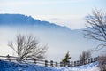 Beautiful french alps winter panoramic aerial view landscape with a fantastic blue haze cloudy mountain background Royalty Free Stock Photo