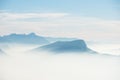 Beautiful french alps winter panoramic aerial view landscape with a fantastic blue haze cloudy mountain background Royalty Free Stock Photo