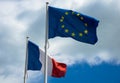 Beautiful French flag and European Union flag waving in the wind. Aerial view. Royalty Free Stock Photo