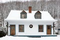 Beautiful french-style ancestral white clapboard double house with blue trimmed windows and dormer windows