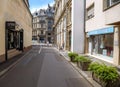 Beautiful French woman walking bulldog on the almost empty street in Strasbourg Royalty Free Stock Photo