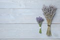 Beautiful fresh and dried lavender flowers on grey wooden table, flat lay. Space for text Royalty Free Stock Photo