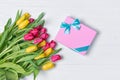 Beautiful fresh yellow and pink tulips bouquet with gift box Royalty Free Stock Photo