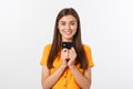 Beautiful friendly smiling confident girl showing black card in hand, isolated over white background. Royalty Free Stock Photo