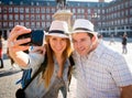 Beautiful friends tourist couple visiting Europe in holidays students exchange taking selfie picture Royalty Free Stock Photo