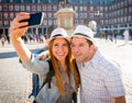 Beautiful friends tourist couple visiting Europe in holidays students exchange taking selfie picture Royalty Free Stock Photo