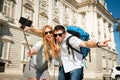 Beautiful friends tourist couple visiting Spain in holidays students exchange taking selfie picture