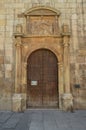 Beautiful Front Facade Of The Church Of Alcala De Henares University With A Nest Of Storks In Its Old Bell Tower. Architecture Tra