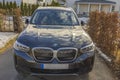 Beautiful front view of BMW IX3 black car electric model.