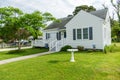 Beautiful front yard of typical American single family homes on Assateague Island. Mowed green lawn. summer sunny day