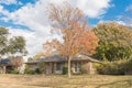 Beautiful front yard of typical single family houses near Dallas in fall season colorful leaves