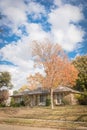 Beautiful front yard of typical single family houses near Dallas in fall season colorful leaves Royalty Free Stock Photo