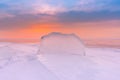 Beautiful frost ice water lake with sunlight skyline background