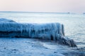A beautiful frozen salt water on the beach of Baltic sea. Ice formations in winter.