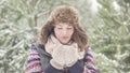 Beautiful frozen woman drinks warm tea