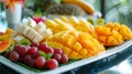 Beautiful fruit platter with sliced mango, grapes and kiwi. Fresh, bright and appetizing food. Royalty Free Stock Photo