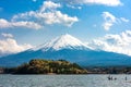 Beautiful Fuji mountain with snow cover on the top with could, J