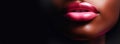 Beautiful full lips with glossy make-up, pink glitter lipstick black girl. Close-up of sexy natural lips giving kiss