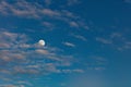 Beautiful full moon in the cloudy evening sky Royalty Free Stock Photo
