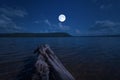 Beautiful full moon over the lake in the winter Royalty Free Stock Photo