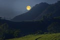 Rising beautiful big moon over the mountains Royalty Free Stock Photo