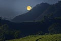 Rising beautiful big moon over the mountains