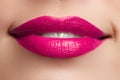 Beautiful full pink lips. Pink lipstick. Make-up and cosmetics