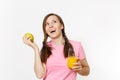 Beautiful fun happy woman holding in hands green apple and orange fresh juice in glass isolated on white background Royalty Free Stock Photo