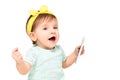 Beautiful funny baby girl with a mobile phone